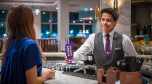 Two people in the holiday extras lounge